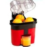 عصارة وقطاعة برتقال كهربائية توضع على الطاولة